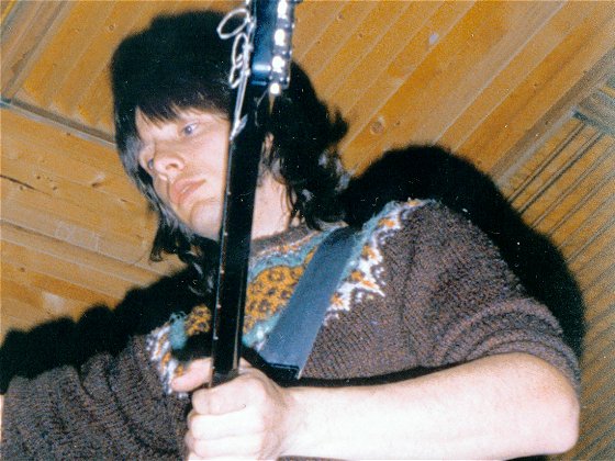 Ray prepares to record a guitar track