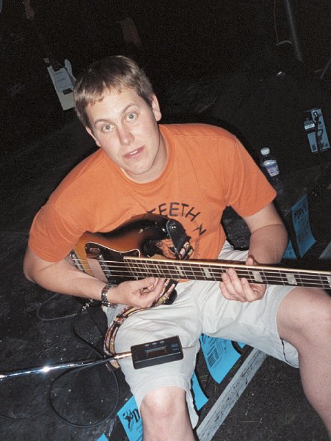 A picture of Rob Sample getting ready to go on stage