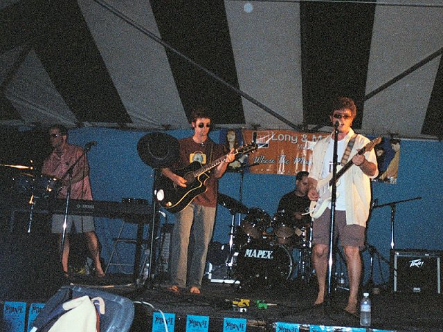 A picture of Stephan Meyer, Matt Scase, Patrick Calnan and Troy Jones in mid-song.