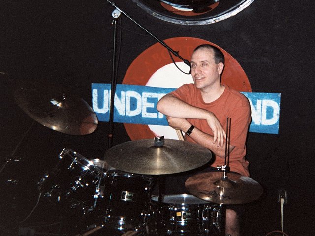 A picture of Patrick Calnan pausing for a rest between songs.