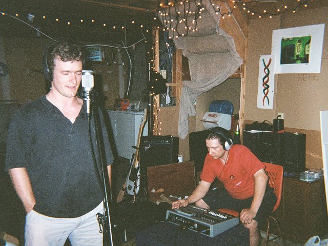 A picture of Troy Jones recording a vocal track with engineer J. Raymond Lavoie