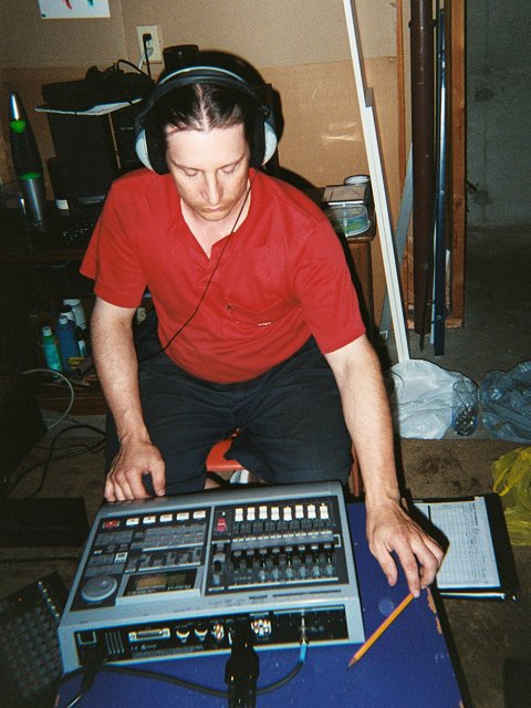 A picture of J. Raymond Lavoie of Lonesome Studios recording some tracks